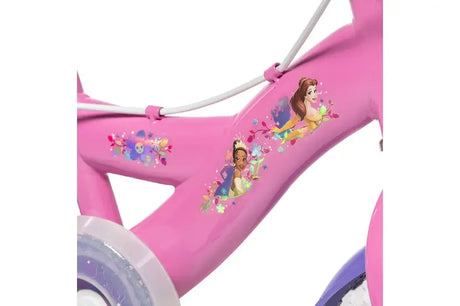 Close up of the pink bike frame with Disney Princess character decals