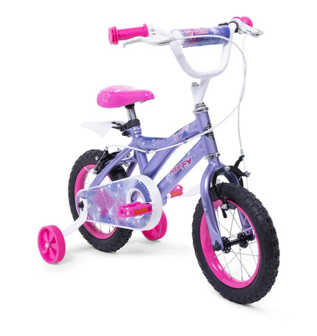 Huffy So Sweet kids bike with purple frame, pink grips, pink saddle, pink wheel rims and pink stabilisers shown from a front angle