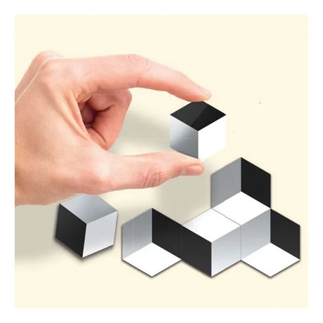 Hand building 3D illusion shapes with black and white cube tiles Ireland