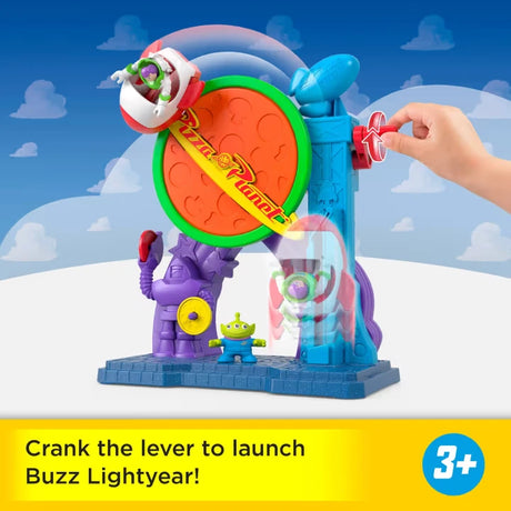 Imaginext Disney Pixar Toy Story Pizza Planet Playset with Buzz Lightyear in the rocket and a hand turning the launcher
