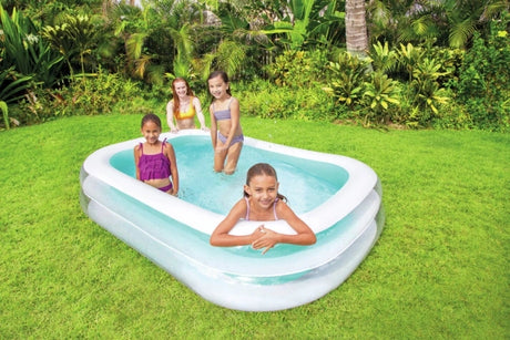 Family using the Intex Swim Center Family Pool on a lawn
