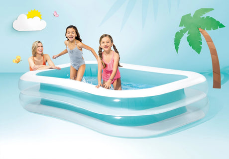 Children and an adult using the Intex Swim Center Family Pool in a studio scene