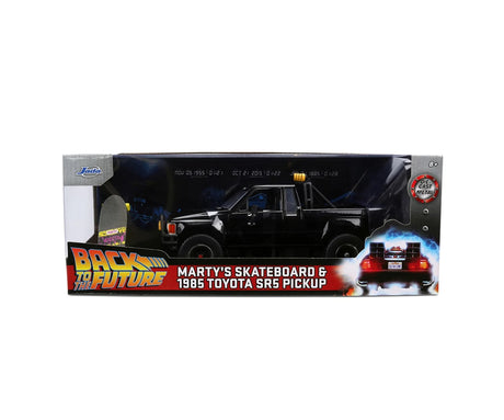 Jada Toys Back to the Future Marty's Skateboard and 1985 Toyota SR5 Pickup retail packaging featuring the black truck and movie branding.