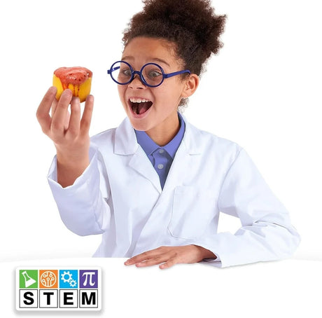 Child using the John Adams Booms Bangs Fizzes Science Kit while observing a foaming chemical reaction