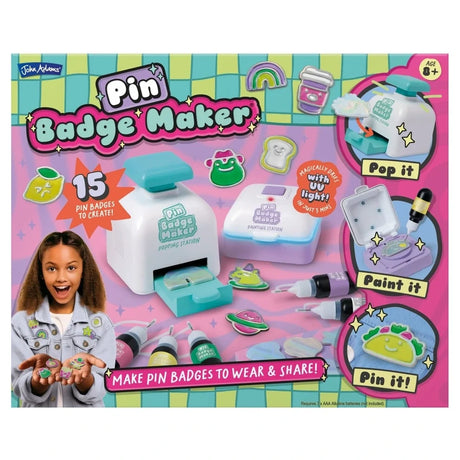 Front of John Adams Pin Badge Maker box showing popping station, UV painting station, gel paints and 15 badges to create
