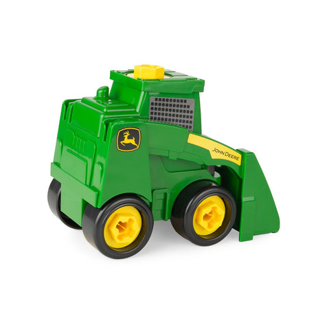 Rear three quarter view of assembled green John Deere Build A Buddy skid steer toy with front bucket and yellow wheels on white background