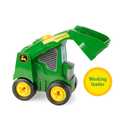 Side view of green John Deere Build A Buddy skid steer toy with loader arm and bucket raised and a yellow “Working loader” badge on white background