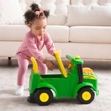 John Deere Johnny Tractor with child lifting yellow seat to open storage compartment