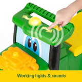 John Deere Johnny Tractor green dashboard with hand pressing yellow light and sound button