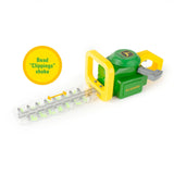 Side view of John Deere toy hedge trimmer with yellow circle text “Bead “Clippings” shake” and arrow along the clear blade section with green beads