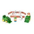 John Deere farm toy playset with two green front loader tractors, four white cow figures, orange fence corral pieces and two farm figures on white background