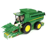 John Deere Lights & Sounds Combine 47714 front left view secured to the retail packaging with corn head fitted