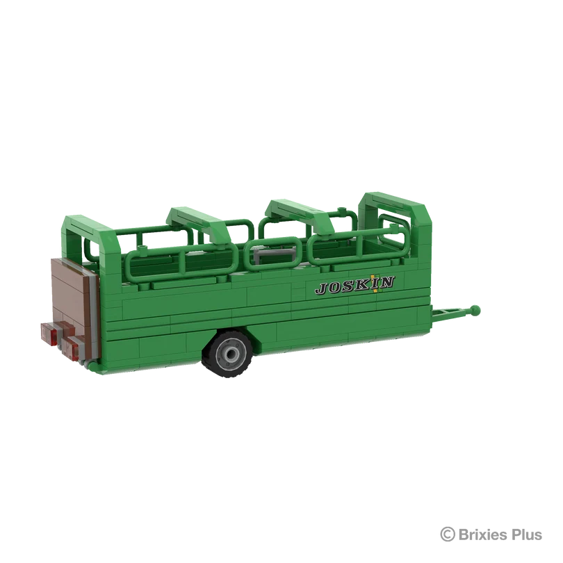 Rear angled view of the BRIXIES Plus Joskin Betimax showing the brown rear gate, side body panels, upper livestock rails and single wheel
