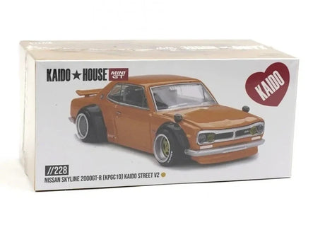 Kaido House Nissan Skyline 2000 GT-R KPGC10 Kaido Street V2 collector box showing printed Safari Gold model artwork, Kaido House and MINI GT logos and model number 228
