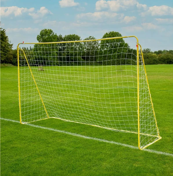 Yellow metal football goal with white netting on grass shown from an angled view