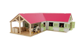 Close-up of Kids Globe pink horse stable doors with horse figures in the boxes