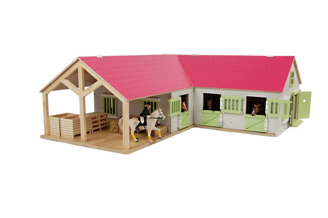 Close-up of Kids Globe pink horse stable doors with horse figures in the boxes