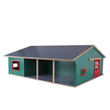 Kids Globe 1:32 wooden cattle farm with green walls, dark blue roof, red-framed windows and open front storage bays on white background