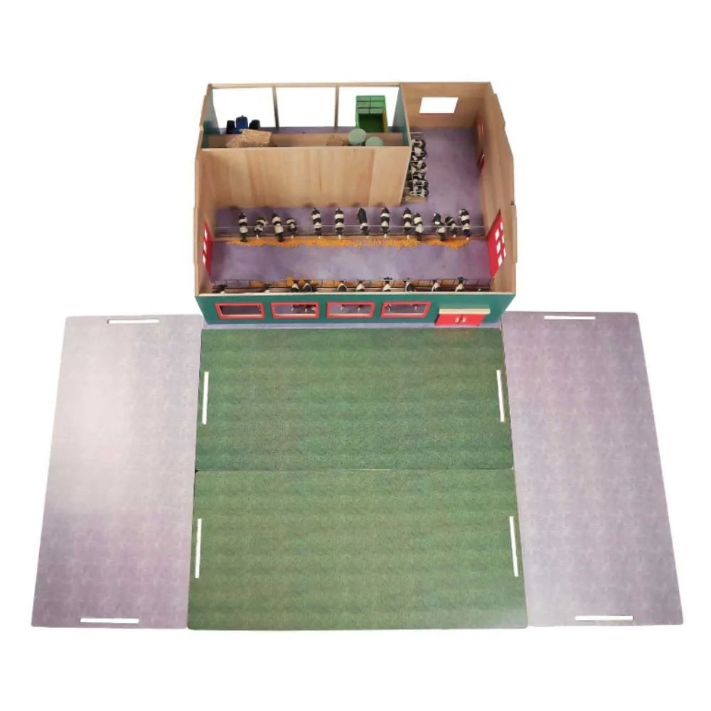 Overhead view of Kids Globe 1:32 wooden cattle farm interior showing cow stalls, hay bales and foldout pasture and yard play surfaces