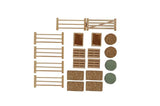 Flat lay of all 19 pieces in the Kids Globe Farming 1:32 Farm Accessory Set including fence sections, gate, two crates, two pallets, four square bales and four round bales