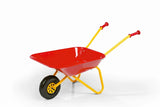 Red and yellow kids metal wheelbarrow with yellow frame in three quarter view