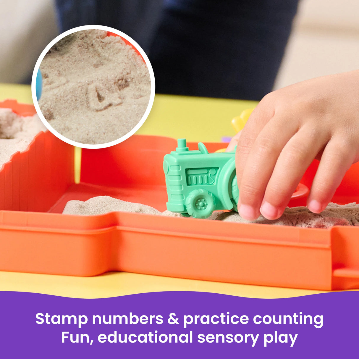 Child using tractor to stamp numbers in Kinetic Sand Sandy Farm Set in Ireland.