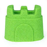 Green Kinetic Sand formed into a sandcastle shape