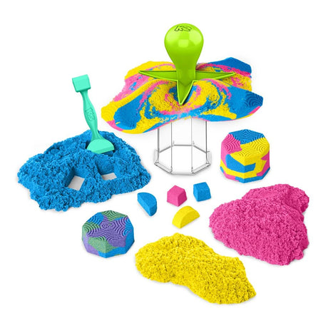 Kinetic Sand Squish N' Create with blue, pink and yellow sand, green squisher tool and shaped sand pieces