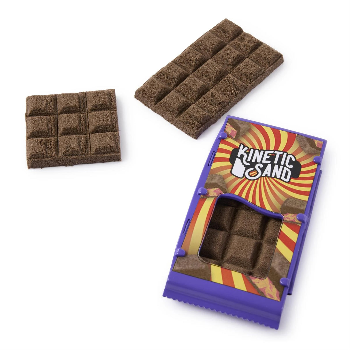 Two brown Kinetic Sand chocolate bar shapes beside a purple wrapper