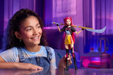 Child holding the KPop Demon Hunters HUNTR/X Mira Doll with her long pink hair, stage outfit and Curved Moon Sword