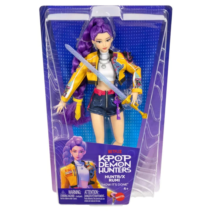 KPop Demon Hunters HUNTR/X Rumi Doll in retail packaging with purple HUNTR/X branding and included sword 