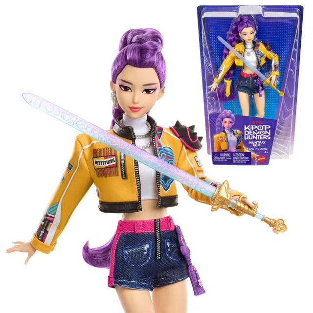 KPop Demon Hunters HUNTR/X Rumi Doll holding her saingeom sword beside the retail packaging