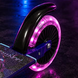 KPop Demon Hunters Takedown Folding Scooter rear wheel illuminated pink, showing the black rear brake guard, purple wheel bracket and decorated scooter deck