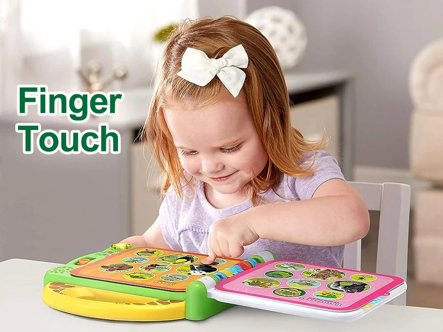 Young girl touching the animal pictures inside an open LeapFrog 100 Animals Book while seated at a table