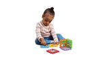 Child sitting on floor playing with LeapFrog 6-in-1 Snap & Learn Busy Cube panels arranged upright