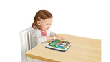 Toddler tapping LeapFrog My First STEAM Tablet on a table during play – Ireland.