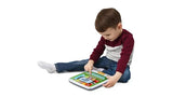 Child sitting on floor playing with LeapFrog My First STEAM Tablet – Ireland.