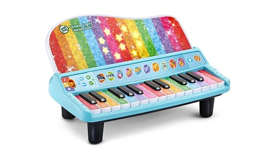 LeapFrog Twinkle Lights Learning Piano viewed at an angle with illuminated stars on the rainbow panel and colourful piano keys