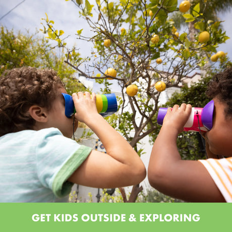 Two kids using GeoSafari Jr. binoculars during garden exploration – Ireland