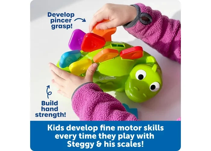 Child placing coloured scales into Learning Resources Steggy the Fine Motor Dino