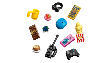 LEGO Friends Heartlake City Friends Club House 42689 accessories including a blue helmet, headphones, gaming controller, walkie talkie, popcorn, drinks and miniature food.