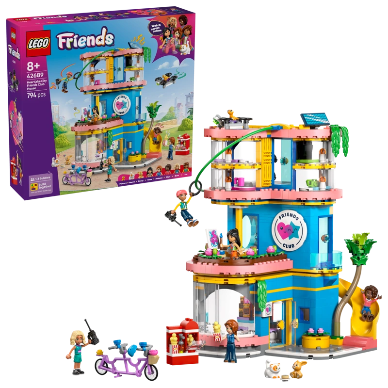 LEGO Friends Heartlake City Friends Club House 42689 retail box displayed beside the completed clubhouse with zip line, slide, minidolls, rooftop drone and tandem bicycle.