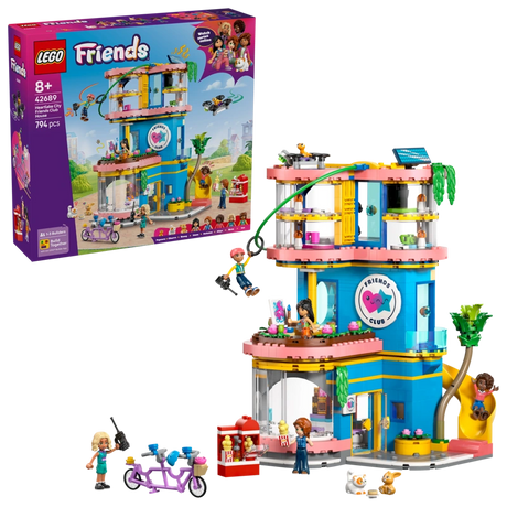 LEGO Friends Heartlake City Friends Club House 42689 retail box displayed beside the completed clubhouse with zip line, slide, minidolls, rooftop drone and tandem bicycle.