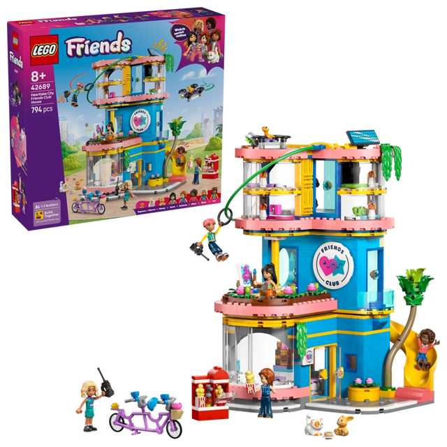 LEGO Friends Heartlake City Friends Club House 42689 retail box displayed beside the completed clubhouse with zip line, slide, minidolls, rooftop drone and tandem bicycle.