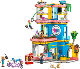 LEGO Friends Heartlake City Friends Club House 42689 showing the colourful three storey clubhouse with zip line, slide, minidolls, tandem bicycle, pets and rooftop drone.