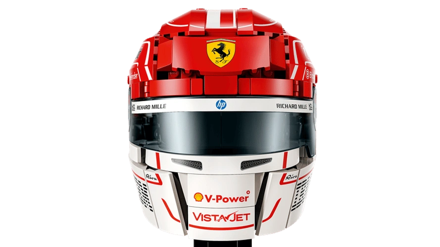 Front close-up of LEGO Scuderia Ferrari HP Charles Leclerc Helmet 43014 showing the red Ferrari helmet, Prancing Horse badge, dark visor, white chin section and V-Power branding.