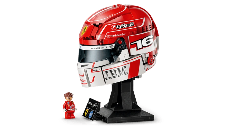 Side view of LEGO Editions Charles Leclerc Ferrari Helmet 43014 showing the red and white livery, number 16, Ferrari badge, sponsor graphics, black display stand and minifigure.
