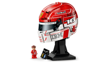 Side view of LEGO Editions Charles Leclerc Ferrari Helmet 43014 showing the red and white livery, number 16, Ferrari badge, sponsor graphics, black display stand and minifigure.