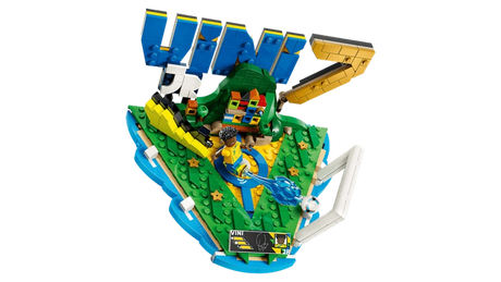 Overhead view of LEGO Editions Vini Jr. Football Highlights 43027 showing the green football display, blue VINI lettering, yellow number 7, Vini Jr. minifigure, football and signature plaque.