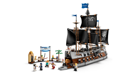 LEGO ONE PIECE Garp's Marine Battleship 75646 showing the complete warship with black sails, open boarding ramp, Marine Victory Day market scene and minifigures arranged around the ship.